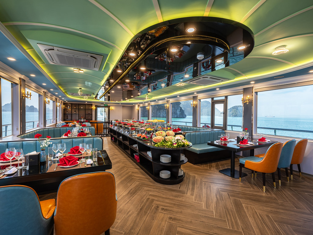 Elegant restaurant on La Casta Cruise offering panoramic views of Ha Long Bay and fine dining experience.