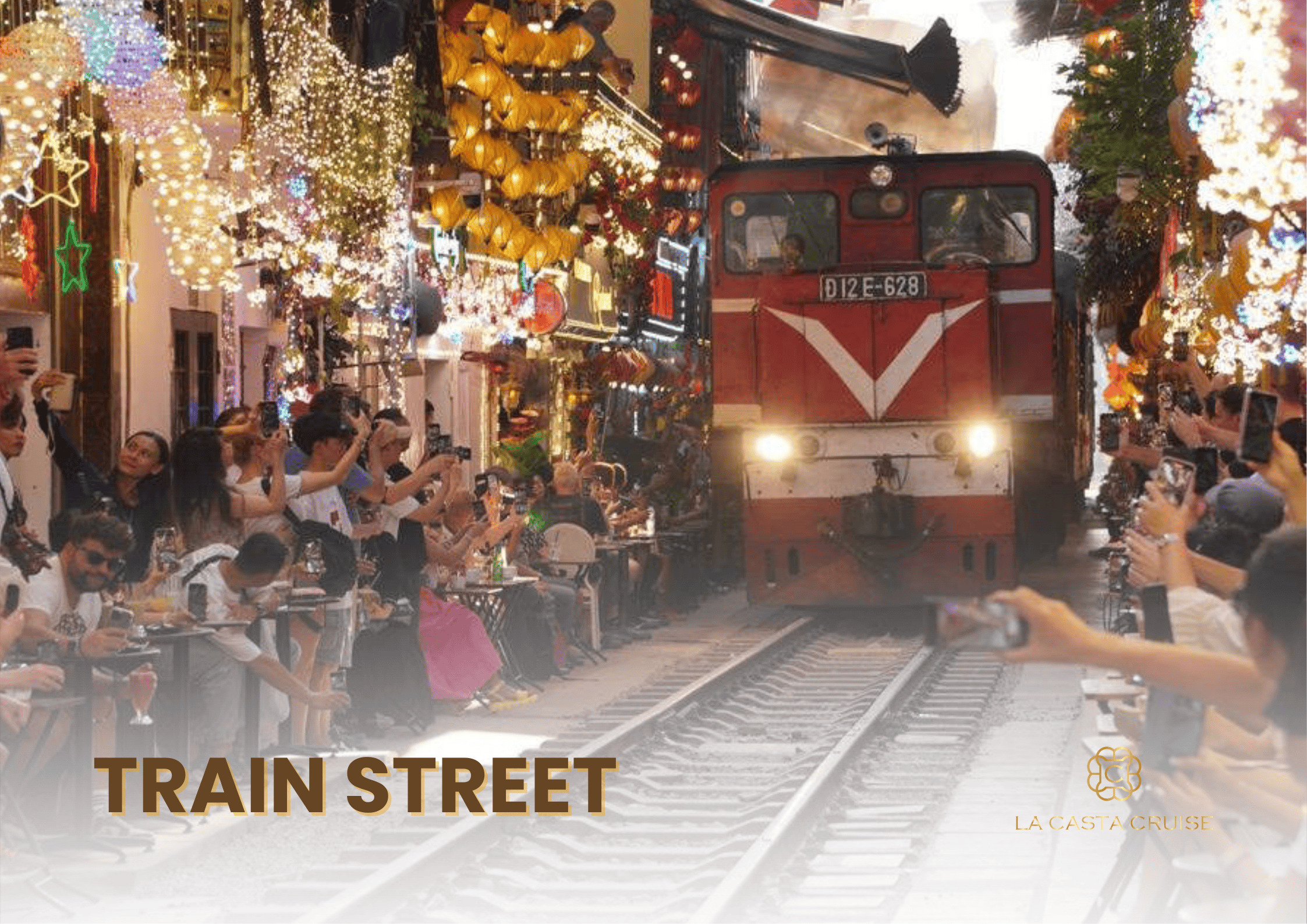 Train Street (Phố Đường Tàu) adorned with bright lanterns and Christmas lights, making it a unique one of the Hanoi Christmas Photo Spots.