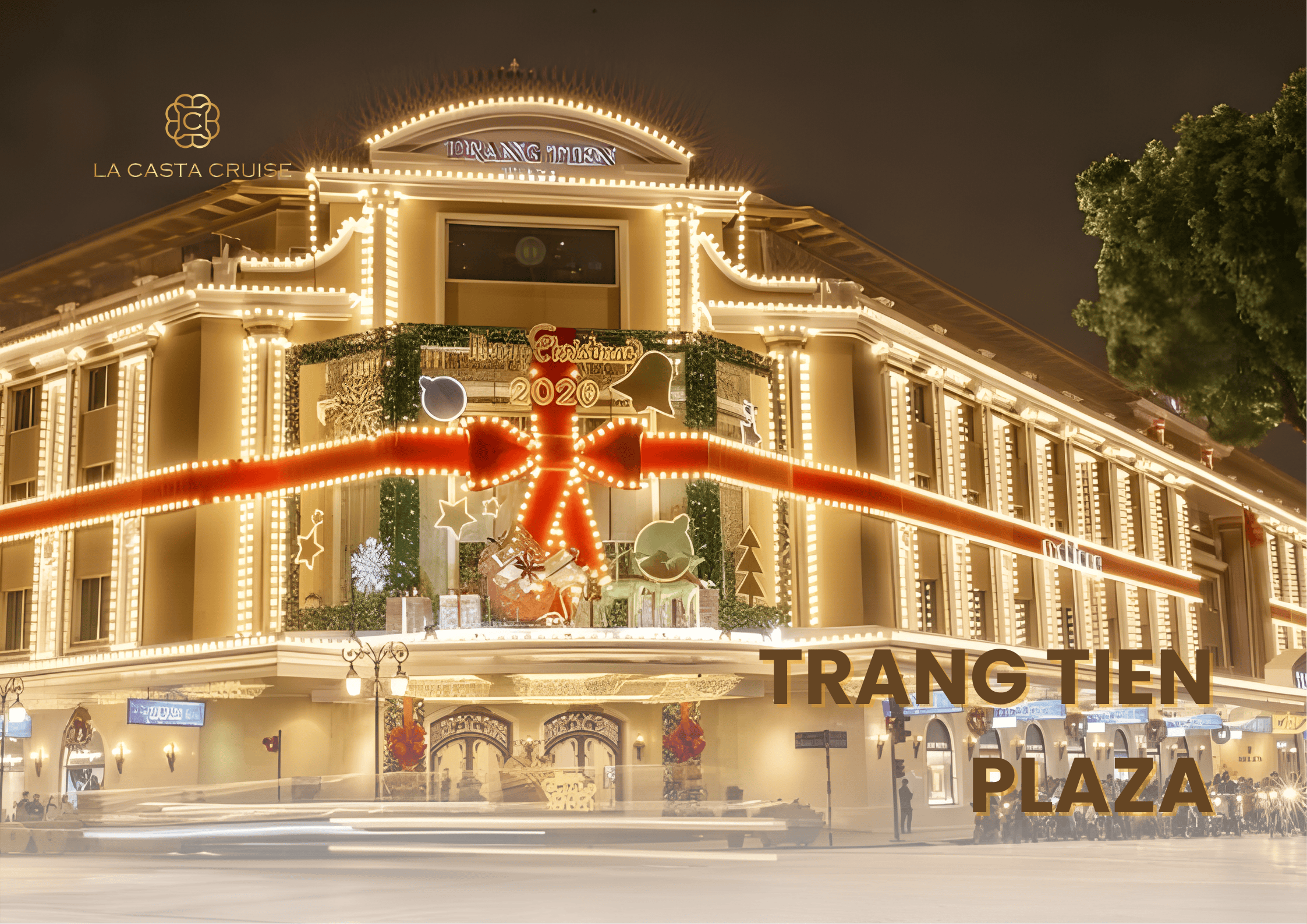Trang Tien Plaza building dressed for Christmas with a giant red ribbon and sparkling golden lights, a luxurious Hanoi Christmas Photo Spots.