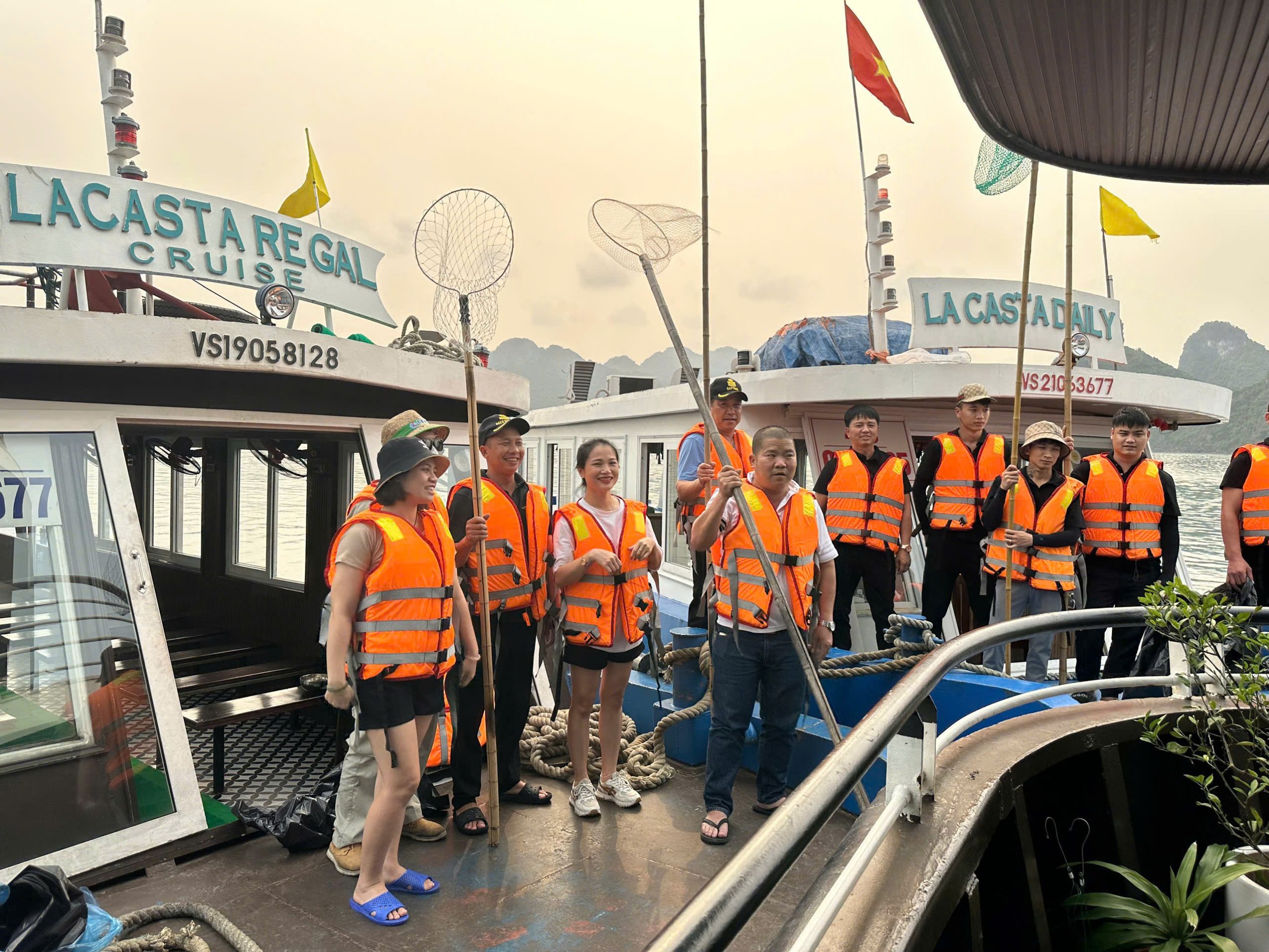 La Casta crew members participating in La Casta volunteer activities during a thorough Halong Bay environmental cleanup.